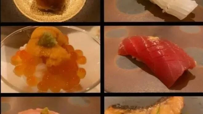 白い皿に盛り付けた握り寿司と海鮮料理の盛り合わせ